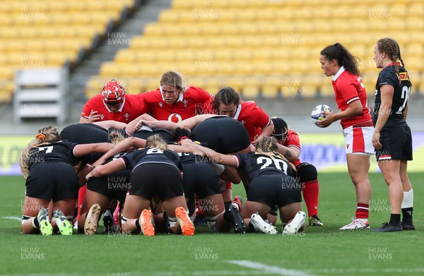 211023 - Wales Women v Canada Women, WXV1 - Donna Rose of Wales, Kelsey Jones of Wales and Abbey Constable of Wales prepare to form a scrum