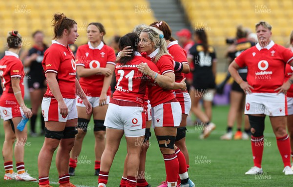 211023 - Wales Women v Canada Women, WXV1 - Meg Davies of Wales and Kerin Lake of Wales embrace at the end of the match