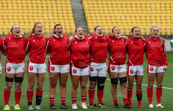 211023 - Wales Women v Canada Women, WXV1 - Members of the Wales team line up for the anthems - left to right, Abbie Fleming, Lisa Neumann, Gwenllian Pyrs, Kelsey Jones, Bethan Lewis, Alisha Butchers, Jasmine Joyce and Hannah Jones 
