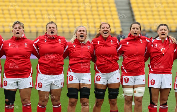 211023 - Wales Women v Canada Women, WXV1 - Members of the Wales team line up for the anthems - left to right, Donna Rose, Carys Phillips, Alex Callender, Georgia Evans, Sioned Harries, and Robyn Wilkins