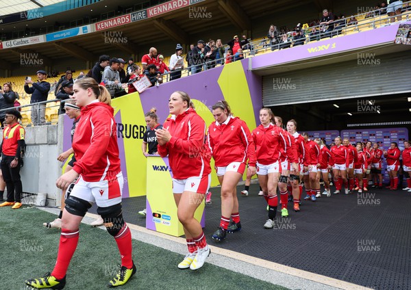 211023 - Wales Women v Canada Women, WXV1 - Bethan Lewis of Wales, Kelsey Jones of Wales, Gwenllian Pyrs of Wales and Lisa Neumann of Wales walk out at the start of the match