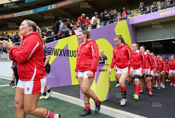 211023 - Wales Women v Canada Women, WXV1 - Kelsey Jones of Wales, Gwenllian Pyrs of Wales, Lisa Neumann of Wales and Abbie Fleming of Wales walk out at the start of the match