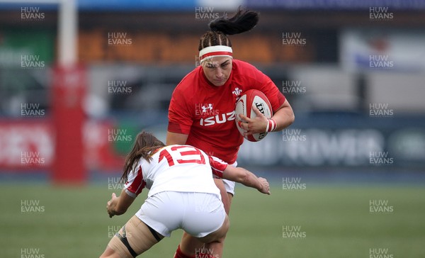 241118 - Wales Women v Canada Women - Friendly - Amy Evans of Wales is tackled by Marie Thibault of Canada