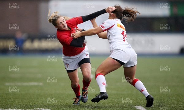241118 - Wales Women v Canada Women - Friendly - Lauren Smyth of Wales is tackled by Sabrina Poulin of Canada