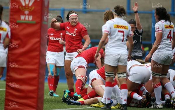 241118 - Wales Women v Canada Women - Friendly - Amy Evans celebrates as Carys Phillips of Wales goes over to score a try
