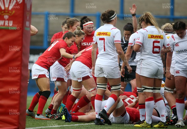 241118 - Wales Women v Canada Women - Friendly - Wales celebrate as Carys Phillips of Wales goes over to score a try