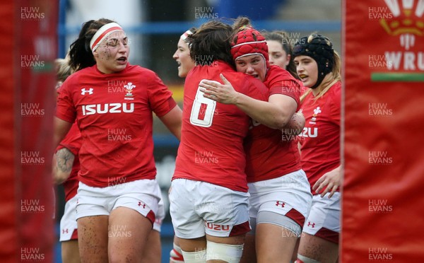 241118 - Wales Women v Canada Women - Friendly - Carys Phillips of Wales celebrates with team mates after scoring a try