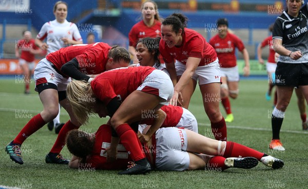 241118 - Wales Women v Canada Women - Friendly - Lisa Neumann of Wales celebrates scoring a try with team mates