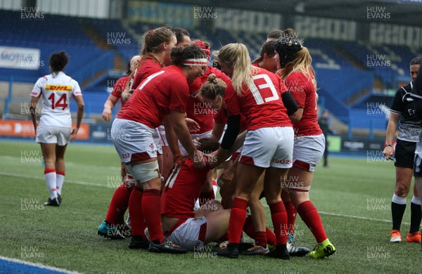 241118 - Wales Women v Canada Women - Friendly - Lisa Neumann of Wales celebrates scoring a try with team mates