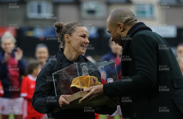 040419 - Wales v Czech Republic, Women's International Challenge Match - Loren Dykes of Wales receives a special cap from Danny Gabbidon to mark her 100th appearance 