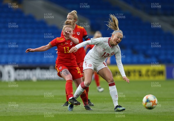 130421 Wales Women v Denmark Women, International Friendly match - Stine Larsen of Denmark is tackled by Rachel Rowe of Wales