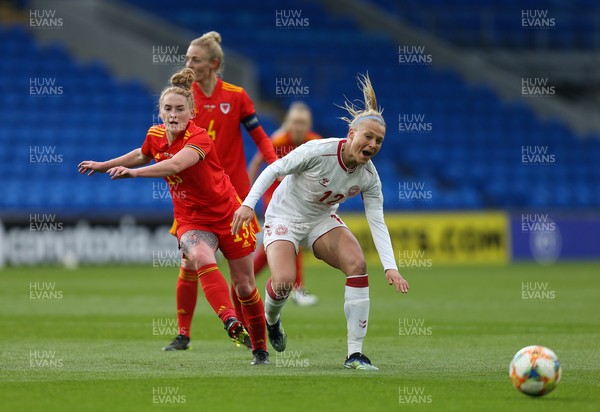 130421 Wales Women v Denmark Women, International Friendly match - Stine Larsen of Denmark is tackled by Rachel Rowe of Wales