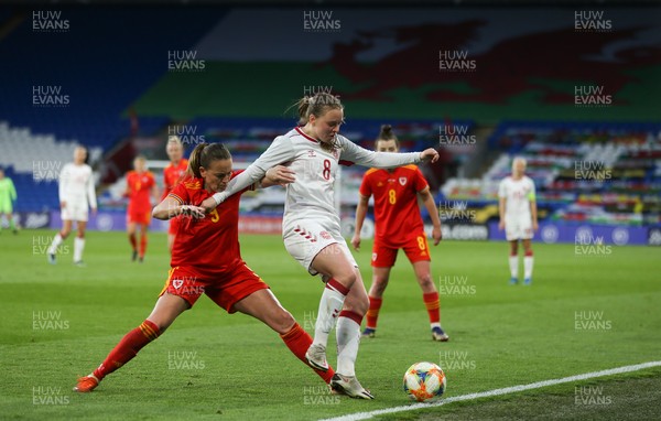 130421 Wales Women v Denmark Women, International Friendly match - Emma Snerle of Denmark holds off Kayleigh Green of Wales