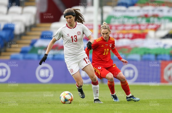 130421 Wales Women v Denmark Women, International Friendly match - Sofie Junge Pedersen of Denmark holds off Jess Fishlock of Wales