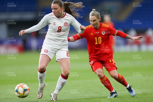130421 Wales Women v Denmark Women, International Friendly match - Emma Snerle of Denmark holds off Jess Fishlock of Wales