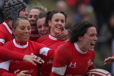 14.02.09 The Women's 6 Nations. Wales vs. England. Taffs Well RFC, Cardiff, Wales. 
 
Wales captsain Mellissa Berry(R) races away in delight as team-mates congratulate her on scoring a try. 
 
