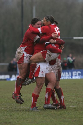 14.02.09 The Women's 6 Nations. Wales vs. England. Taffs Well RFC, Cardiff, Wales. 
 
Non Evan(15) is mobbed by jubilant team-mates as her penalty with the last kick of the match wins a tight game for Wales. 
 
