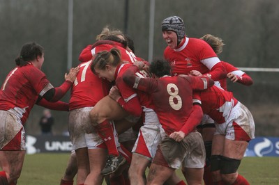 14.02.09 The Women's 6 Nations. Wales vs. England. Taffs Well RFC, Cardiff, Wales. 
 
Non Evan(15) is mobbed by jubilant team-mates as her penalty with the last kick of the match wins a tight game for Wales. 
 
