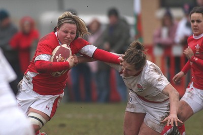 14.02.09 The Women's 6 Nations. Wales vs. England. Taffs Well RFC, Cardiff, Wales. 
 
Rhian Bowden hands off Lois Moulding. 
 
