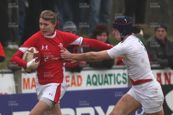 14.02.09 The Women's 6 Nations. Wales vs. England. Taffs Well RFC, Cardiff, Wales. 
 
Ali Wright tries to hand off Joanna McGilchrist. 
 
