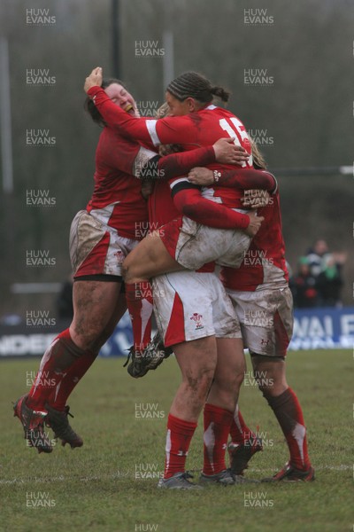14.02.09 The Women's 6 Nations. Wales vs. England. Taffs Well RFC, Cardiff, Wales. 
 
Non Evan(15) is mobbed by jubilant team-mates as her penalty with the last kick of the match wins a tight game for Wales. 
 
