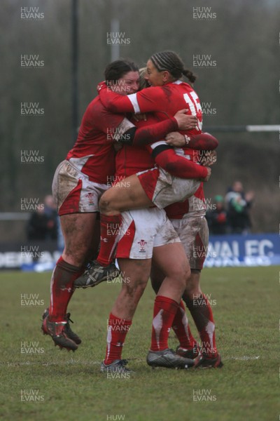 14.02.09 The Women's 6 Nations. Wales vs. England. Taffs Well RFC, Cardiff, Wales. 
 
Non Evan(15) is mobbed by jubilant team-mates as her penalty with the last kick of the match wins a tight game for Wales. 
 
