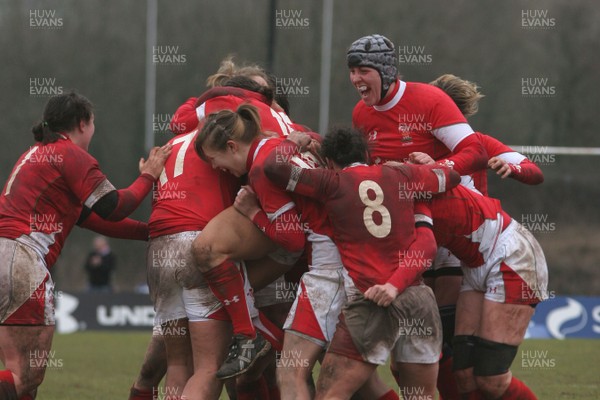 14.02.09 The Women's 6 Nations. Wales vs. England. Taffs Well RFC, Cardiff, Wales. 
 
Non Evan(15) is mobbed by jubilant team-mates as her penalty with the last kick of the match wins a tight game for Wales. 
 
