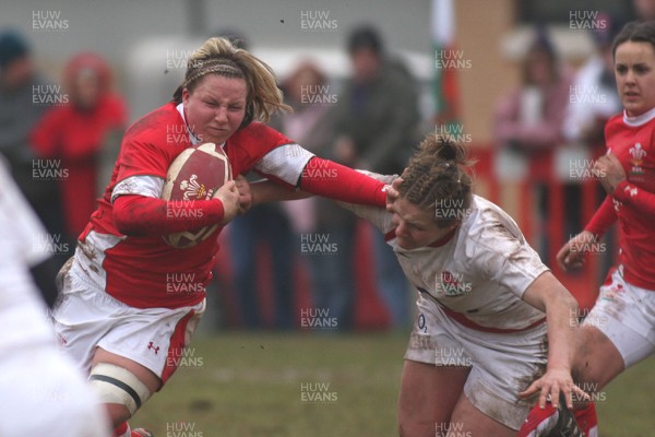14.02.09 The Women's 6 Nations. Wales vs. England. Taffs Well RFC, Cardiff, Wales. 
 
Rhian Bowden hands off Lois Moulding. 
 
