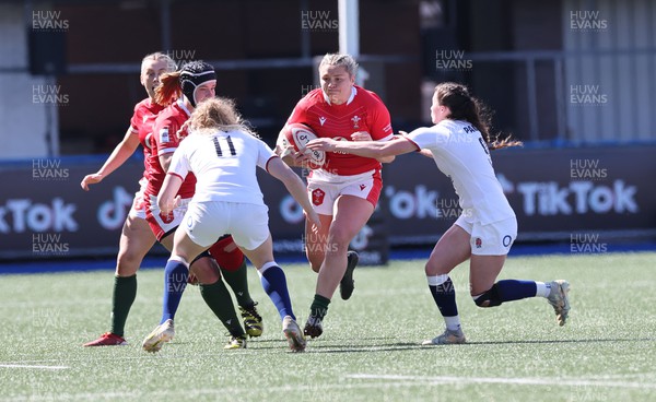 150423 - Wales v England, TicTok Women’s 6 Nations - Hannah Bluck of Wales takes on Lucy Packer of England and Abby Dow of England
