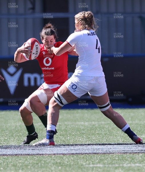 150423 - Wales v England, TicTok Women’s 6 Nations - Sioned Harries of Wales is stopped by Zoe Aldcroft of England