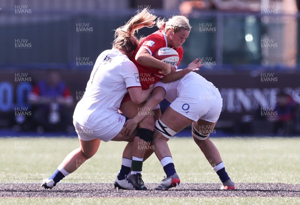 150423 - Wales v England, TicTok Women’s 6 Nations - Kelsey Jones of Wales is tackled