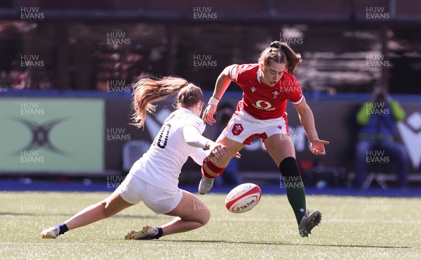 150423 - Wales v England, TicTok Women’s 6 Nations - Lisa Neumann of Wales is tackled by Holly Aitchison of England