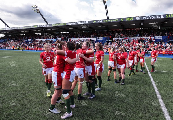 150423 - Wales v England, TicTok Women’s 6 Nations - The Welsh team hug each other at the end of the match