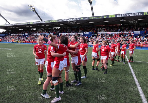 150423 - Wales v England, TicTok Women’s 6 Nations - The Welsh team hug each other at the end of the match