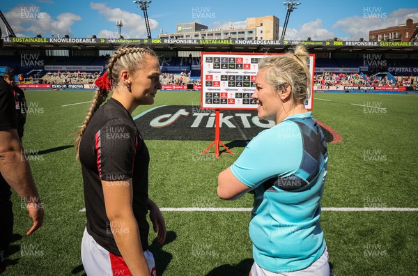 150423 - Wales v England, TicTok Women’s 6 Nations - Hannah Jones of Wales with Marlie Packer of England ahead of the coin toss