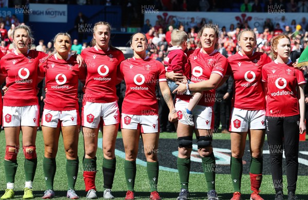 150423 - Wales v England, TicTok Women’s 6 Nations - Left to right, Elinor Snowsill of Wales, Lowri Norkett of Wales, Lisa Neumann of Wales, Ffion Lewis of Wales, Natalia John of Wales with Morgan, and Hannah Jones of Wales with match mascot line up for the anthems