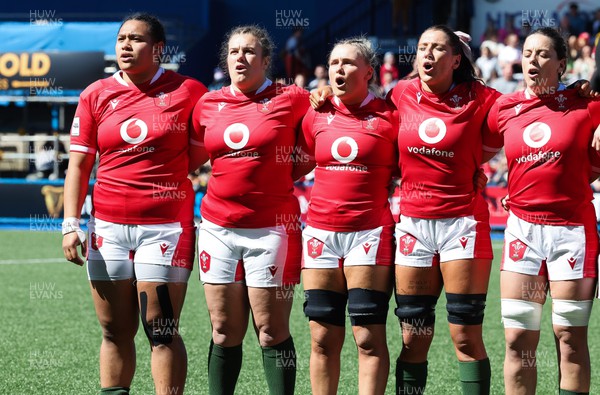 150423 - Wales v England, TicTok Women’s 6 Nations - Left to right, Sisilia Tuipulotu, Carys Phillips, Alex Callender, Georgia Evans and Sioned Harries line up for the anthems