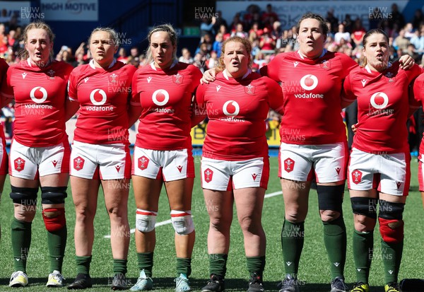150423 - Wales v England, TicTok Women’s 6 Nations - Left to right, Abbie Fleming, Hannah Bluck, Courtney Keight, Cara Hope, Cerys Hale and Bethan Lewis line up for the anthems