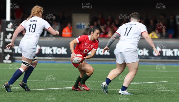 150423 - Wales v England, TicTok Women’s 6 Nations - Ffion Lewis of Wales takes on Delaney Burns of England an Abby Dow of England