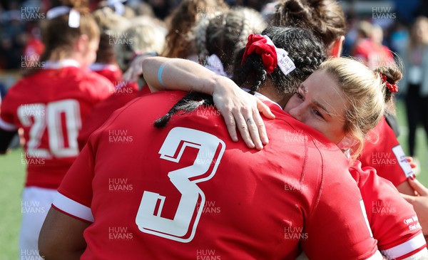 150423 - Wales v England, TicTok Women’s 6 Nations - Sisilia Tuipulotu of Wales and Keira Bevan of Wales embrace at the end of the match