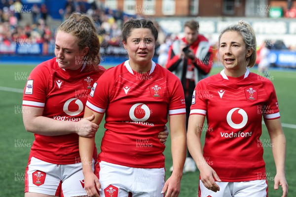 150423 - Wales v England, TicTok Women’s 6 Nations - Abbie Fleming of Wales, Robyn Wilkins of Wales and Elinor Snowsill of Wales at the end of the match