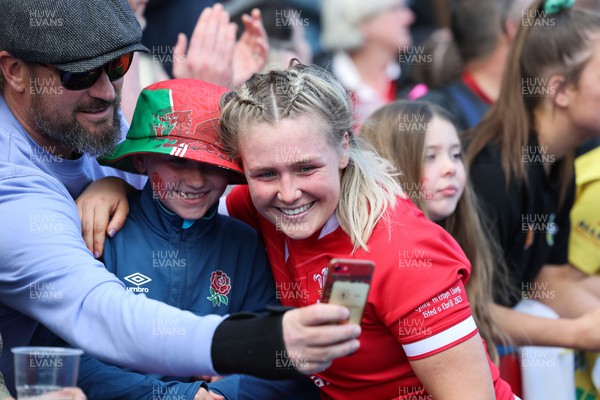 150423 - Wales v England, TicTok Women’s 6 Nations - Alex Callender of Wales meets family, friends and fans at the end of the match