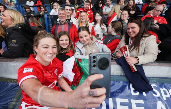 150423 - Wales v England, TicTok Women’s 6 Nations - Keira Bevan of Wales meets family, friends and fans at the end of the match