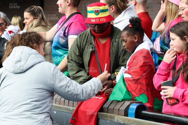 150423 - Wales v England, TicTok Women’s 6 Nations - Natalia John of Wales signs autographs at the end of the match