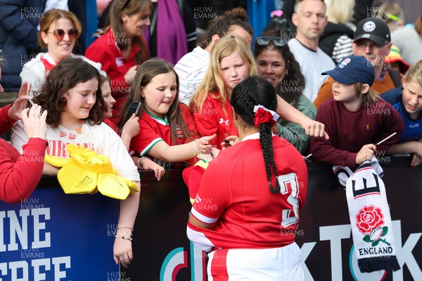 150423 - Wales v England, TicTok Women’s 6 Nations - Sisilia Tuipulotu of Wales greets family, friends and fans at the end of the match