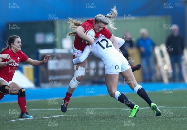 240219 - Wales v England, Women's Six Nations Championship 2019 - Hannah Bluck of Wales is tackled by Zoe Harrison of England