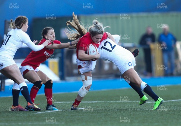 240219 - Wales v England, Women's Six Nations Championship 2019 - Hannah Bluck of Wales is tackled by Zoe Harrison of England