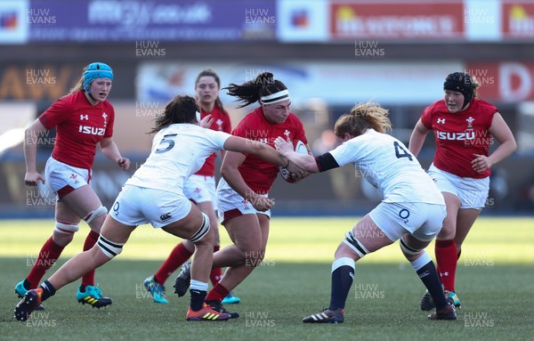240219 - Wales v England, Women's Six Nations Championship 2019 - Amy Evans of Wales takes on Abbie Scott of England and Catherine O’Donnell of England