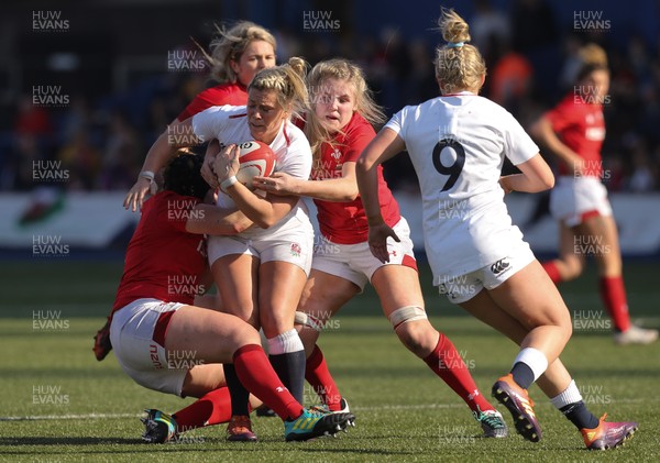 240219 - Wales v England, Women's Six Nations Championship 2019 - Rachael Burford of England is tackled by Caryl Thomas of Wales and Alex Callender of Wales