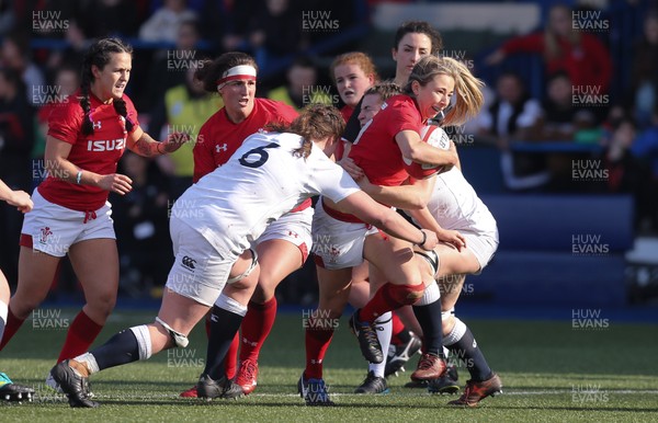 240219 - Wales v England, Women's Six Nations Championship 2019 - Elinor Snowsill of Wales is tackled by Sarah Beckett of England